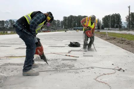 Concrete leveling work on a settled slab at a Fayetteville, Arkansas home