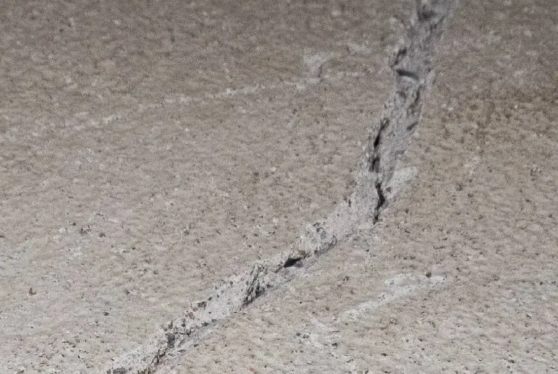 Cracked concrete foundation being repaired on a Northwest Arkansas home